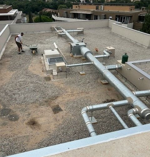 Toiture terrasse avec isolation thermique et protection gravillon